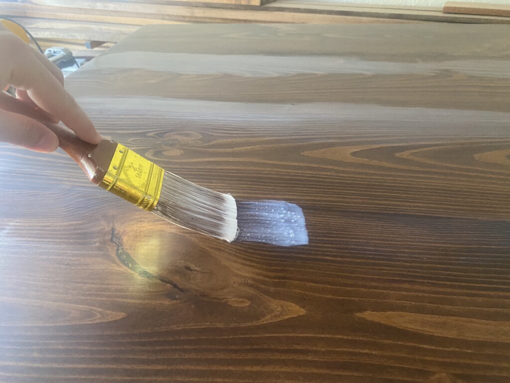 applying the finish to the coffee table