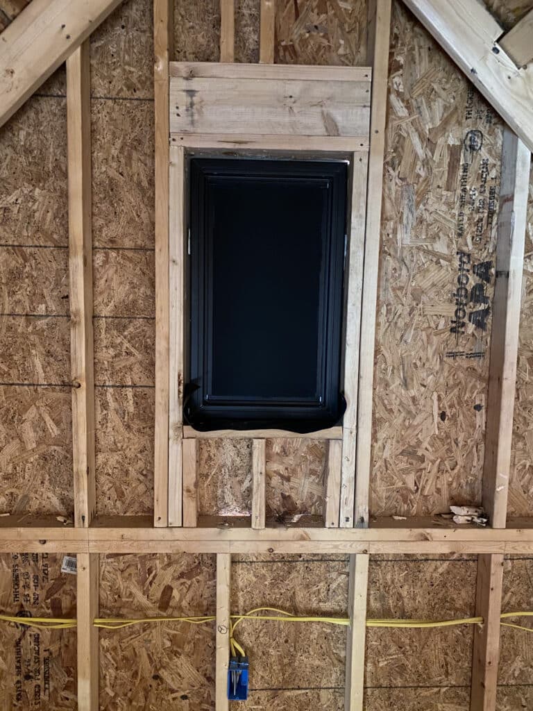 How do you attach blackout material to a window