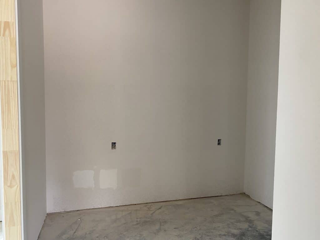empty space for future mudroom built ins