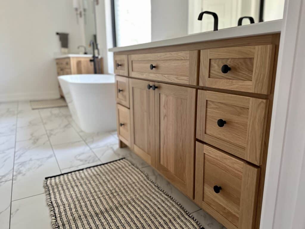 vanities on either side of tub in bathroom