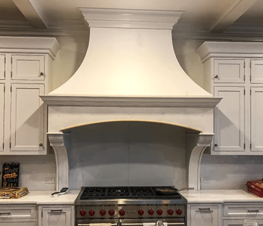 ornate traditional white curved range hood cover